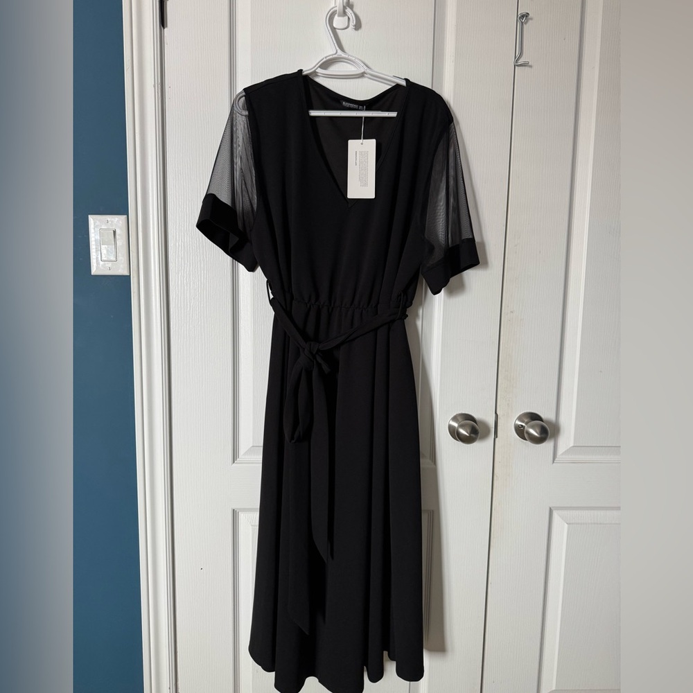 NWT beautiful BloomChic dress with see through sleeves